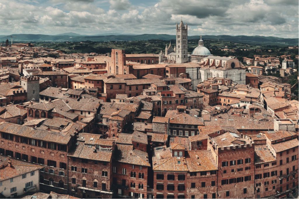 Medieval town Siena rooftop view with historic buildings in Italy