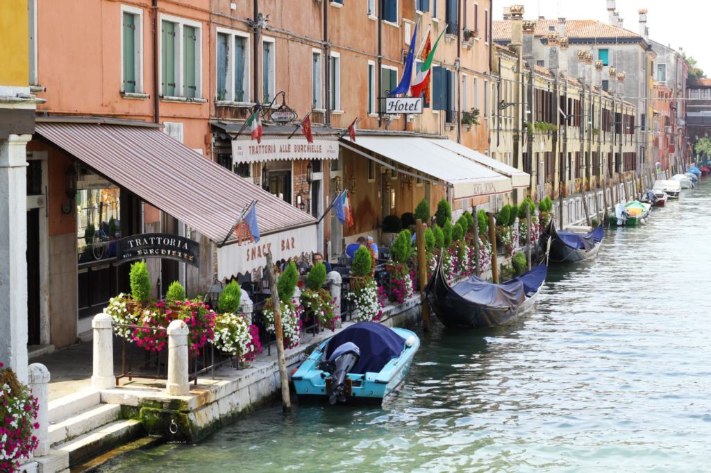 Shops right next to the canals in Venice, Italy
