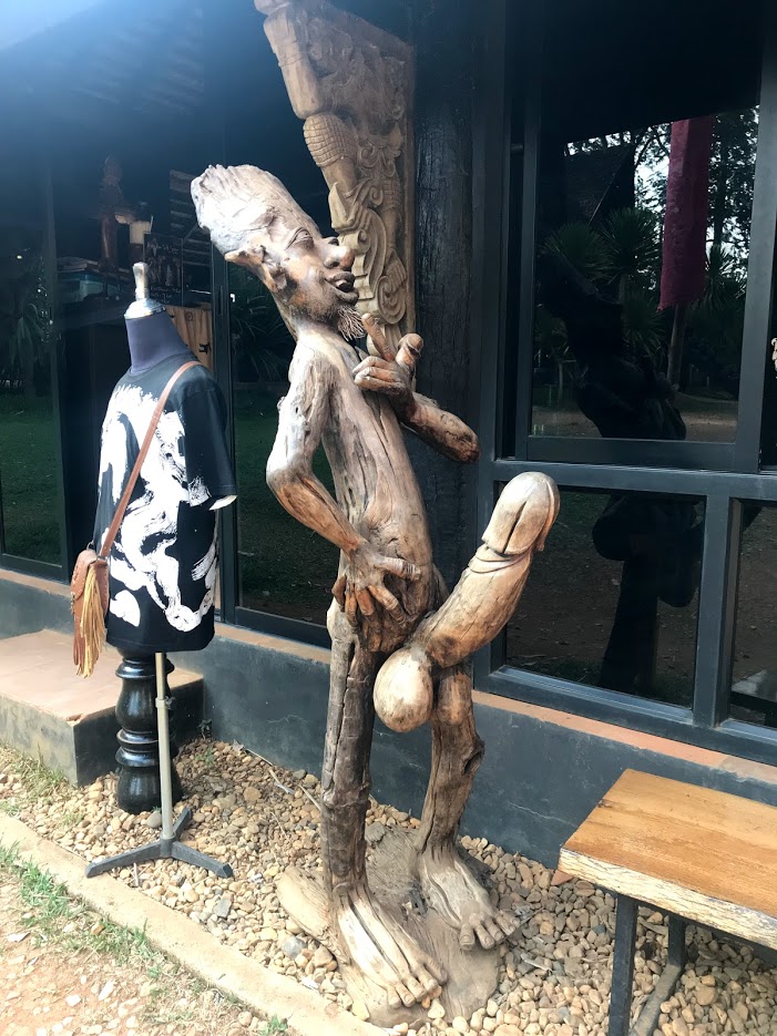 A wooden statue with an enlarged penis at Baan Dam, Chiang Rai