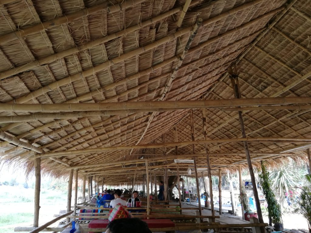 Bamboo huts next to the river bed at Chiang Rai Beach