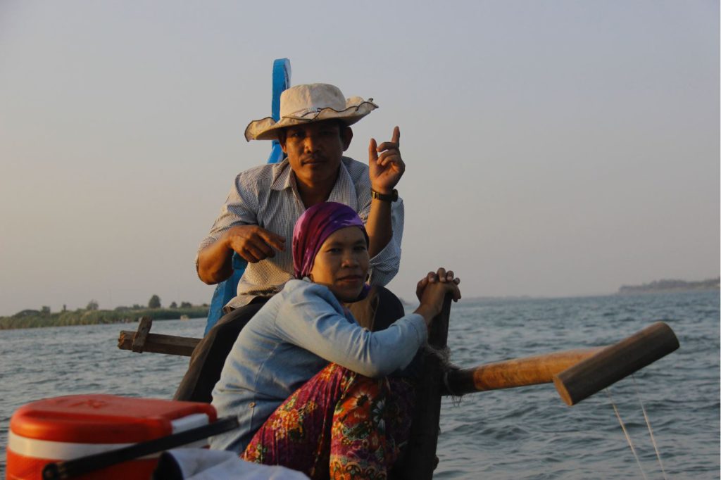 Locals on a lake in Cambodia