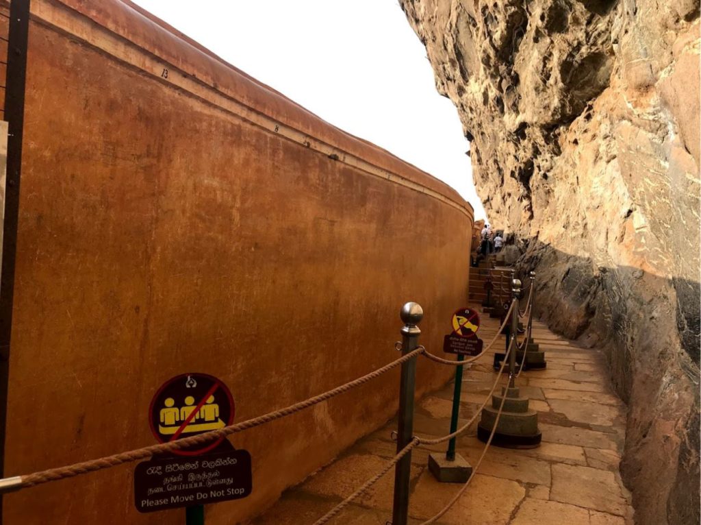 The mirror wall at Sigiriya reflects the artworks on the opposite wall