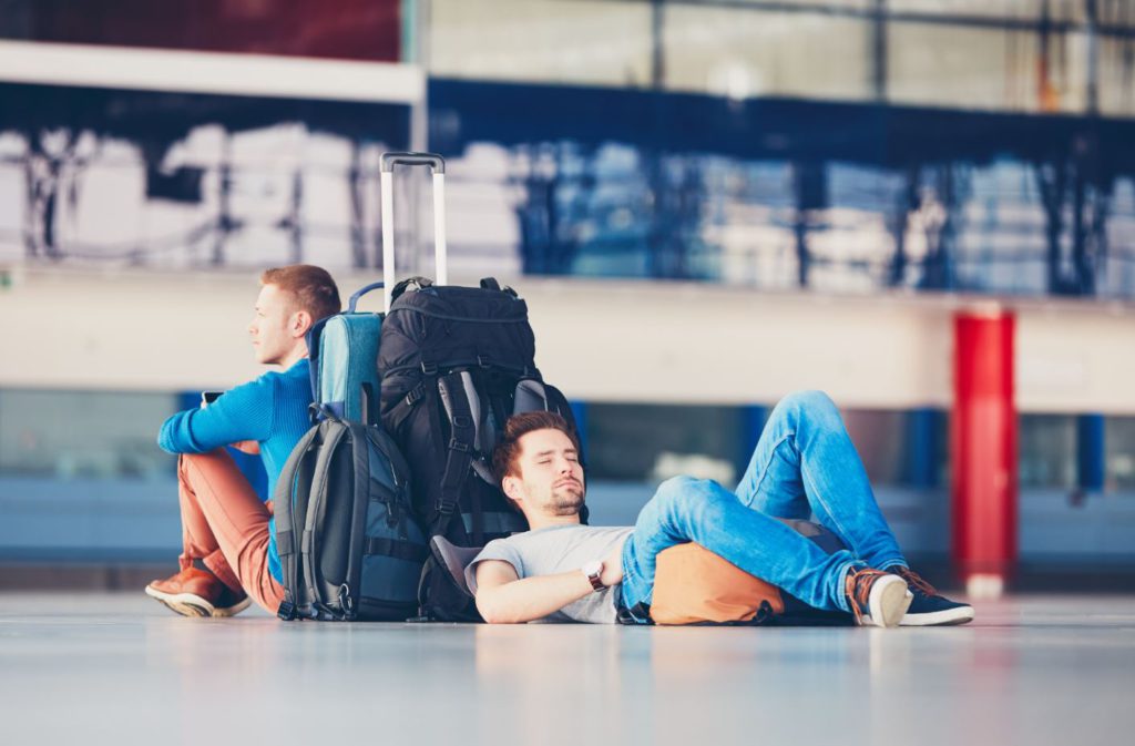 Men waiting at the airport, Solo travel overhype