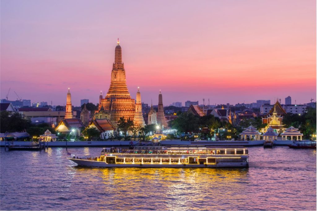 Wat Arun after sunset with cruise on Chao Phraya river