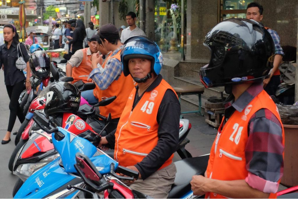 Motorcycle taxis in Bangkok at a taxi stand