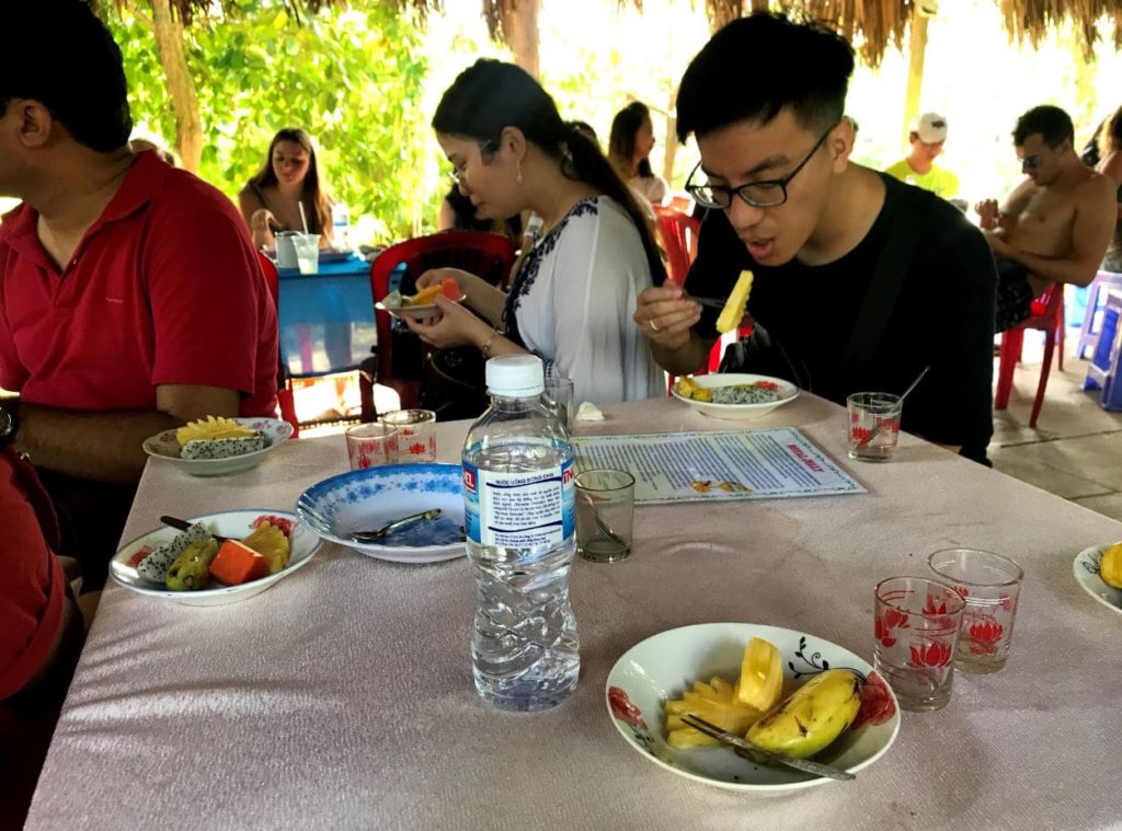 Fresh cut fruits served with tea and honey in Mekong Delta, Vietnam