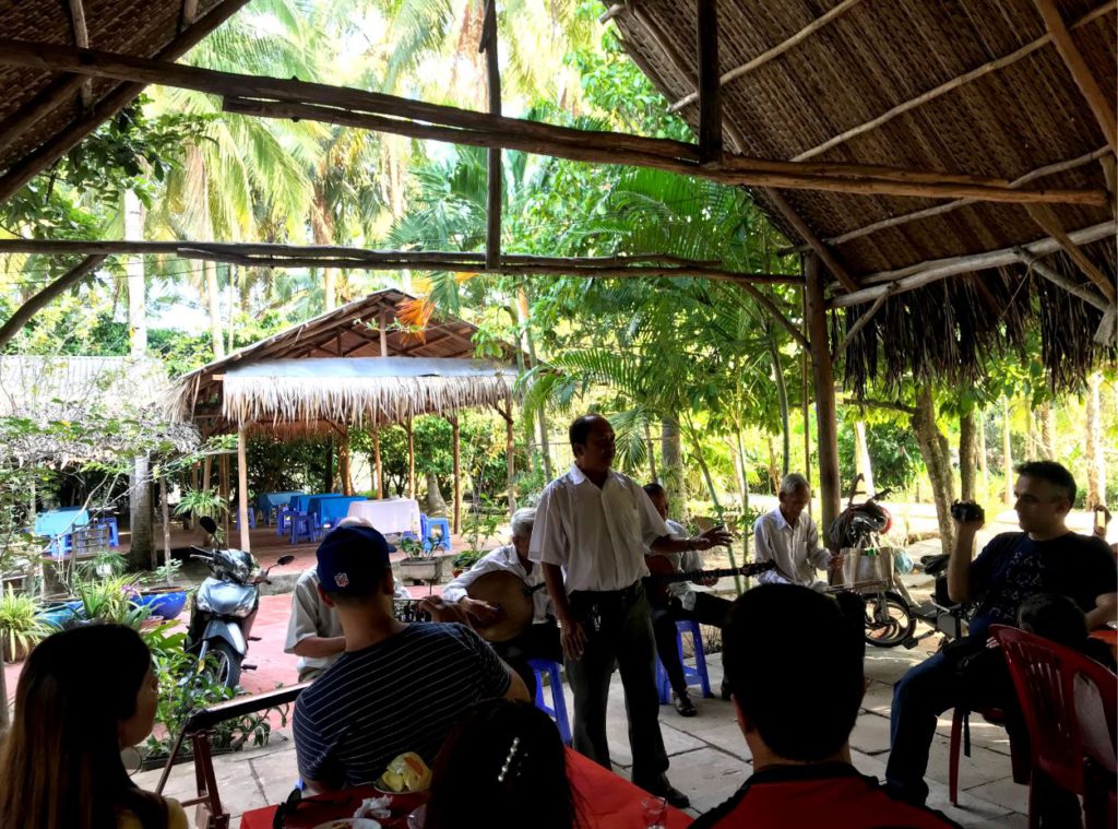 Locals singing traditional local songs for the tourists