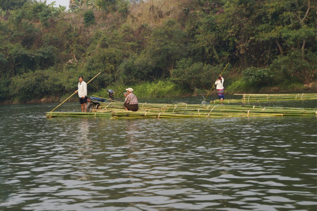 People on Bamboo Rafts