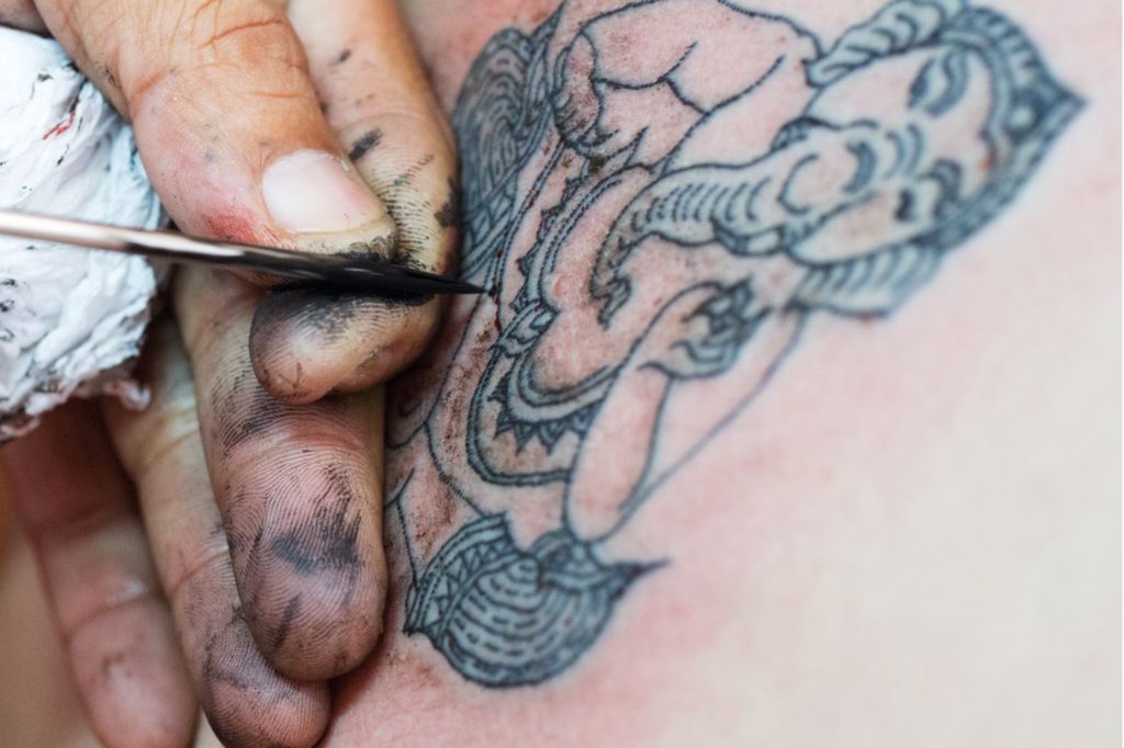 Figure of Hindu deity Ganesha as a Sak Yant tattoo