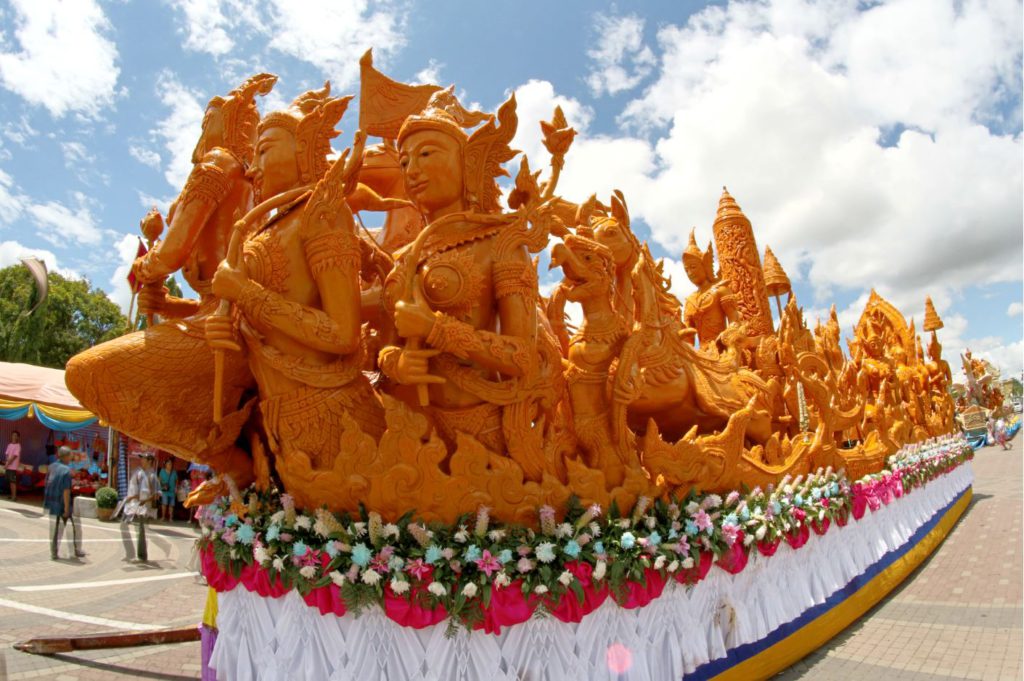 Intricate floats made of wax from Buddhist stories, Festival in thailand