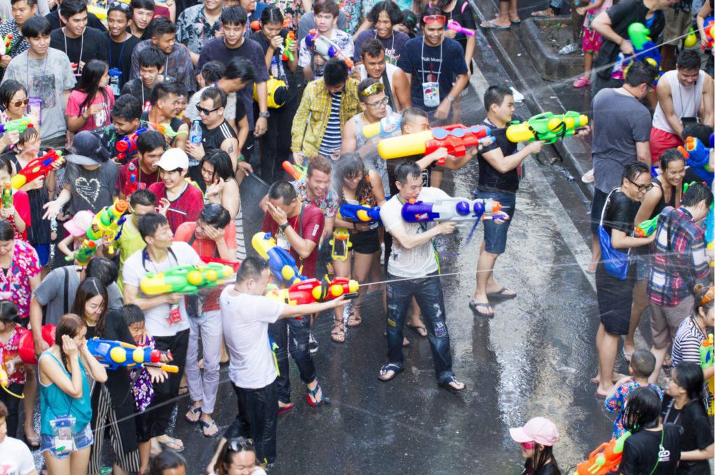 People fighting with waterguns in Songkran, Festival in thailand