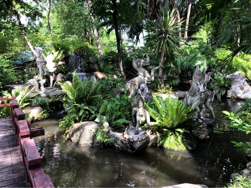 Garden with decorative sculptures and fountains, Erawan museum