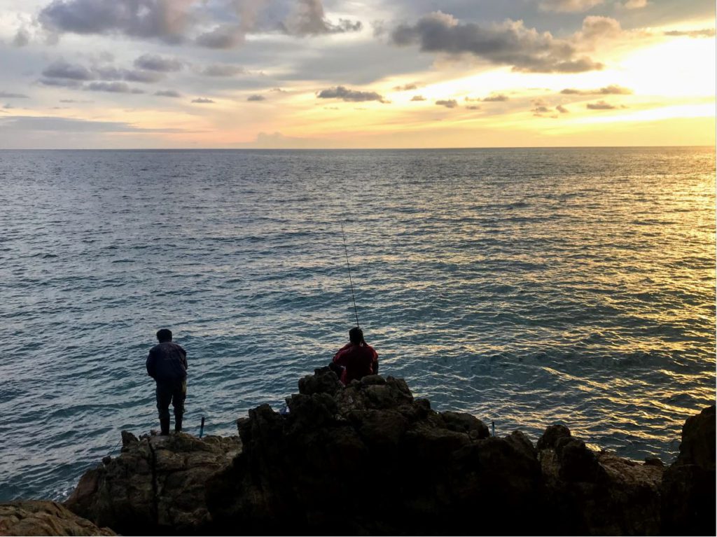 Men Fishing on an empty shore