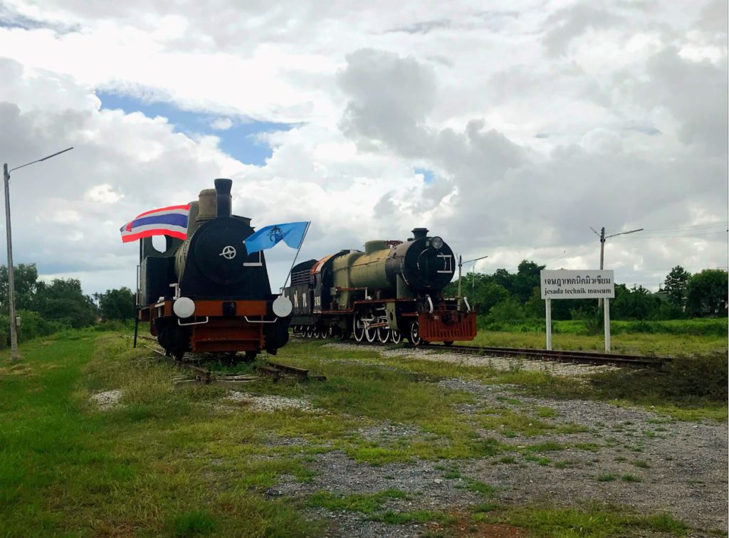 Two steam engines near a railway track outside the museum, Jesada Technik Museum