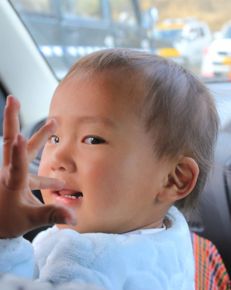 Our companion in a shared taxi to Punakha