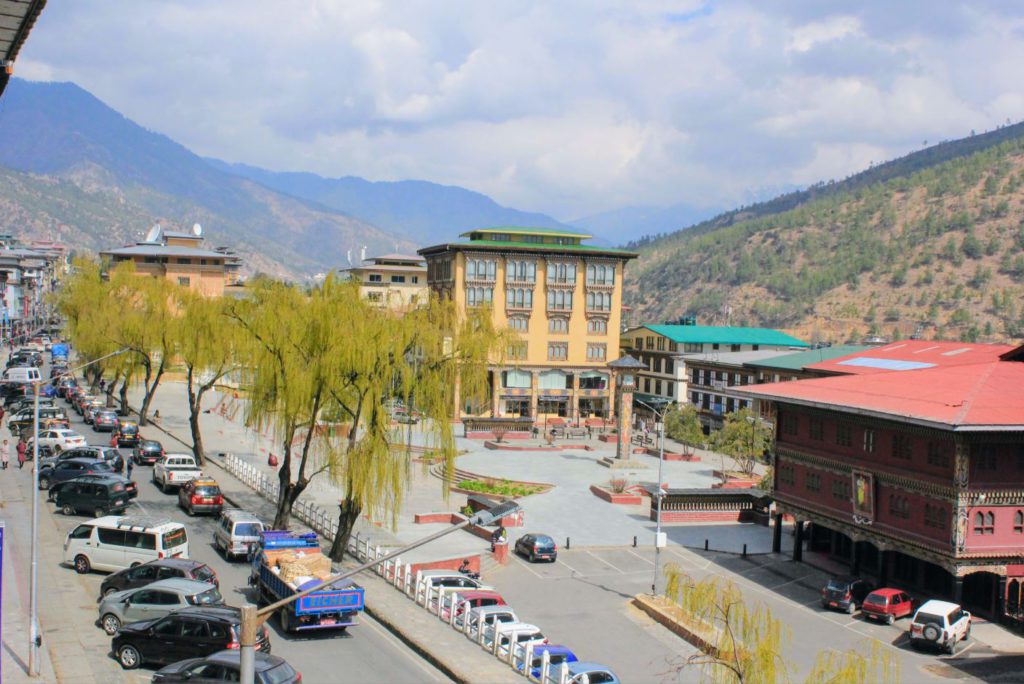 Thimphu clock tower square in the right side beside the maroon building
