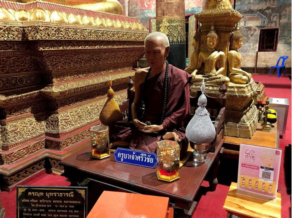 A fiberglass statue of a monk inside Wat Phumin, Nan, Thailand