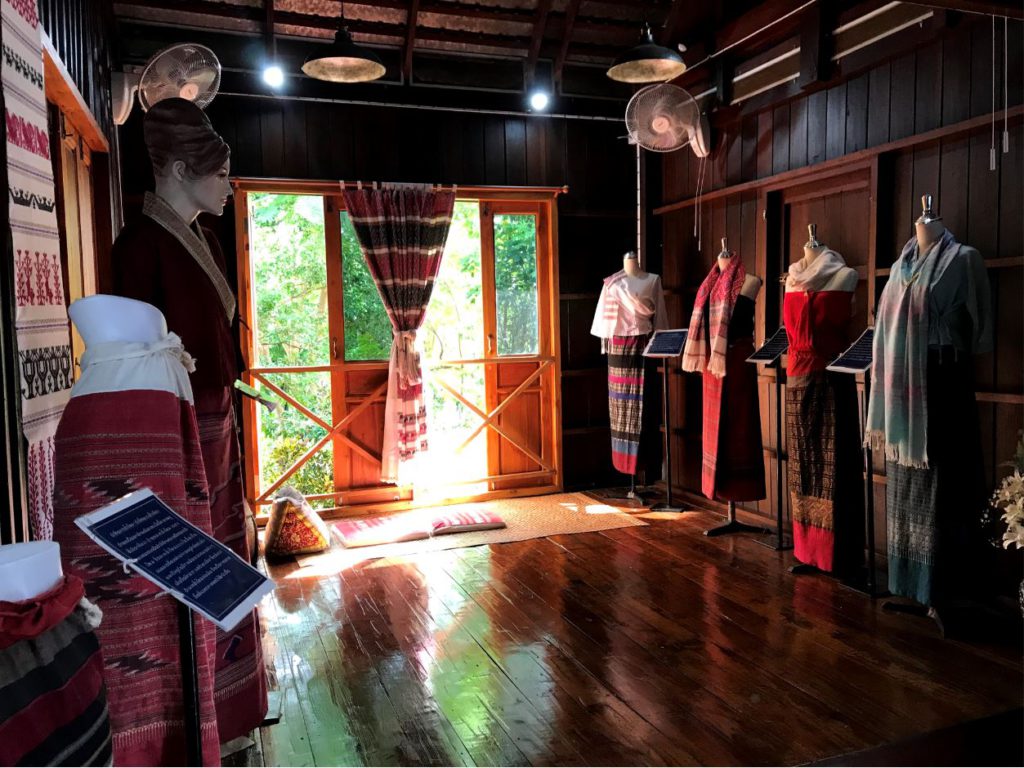 Local weaving garments inside The Noble House, Nan