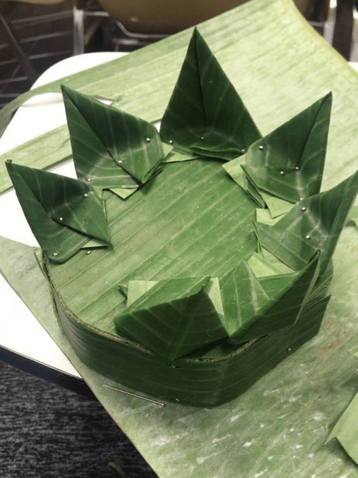 Attach Banana leaves strip on the sides of the base on top