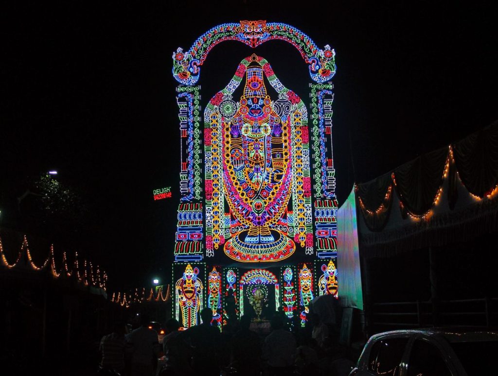 A lit portrait of Lord ventakeshwara during Navratri