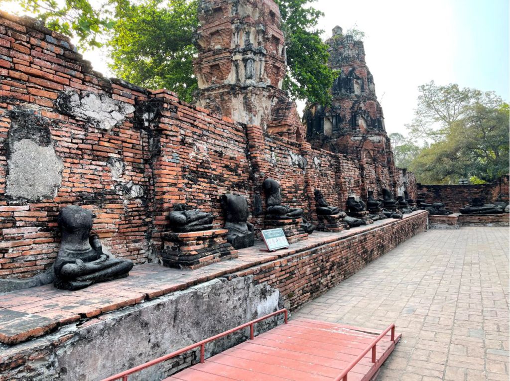 A series of burned Buddha statues around Wat Maha That, Ayutthaya