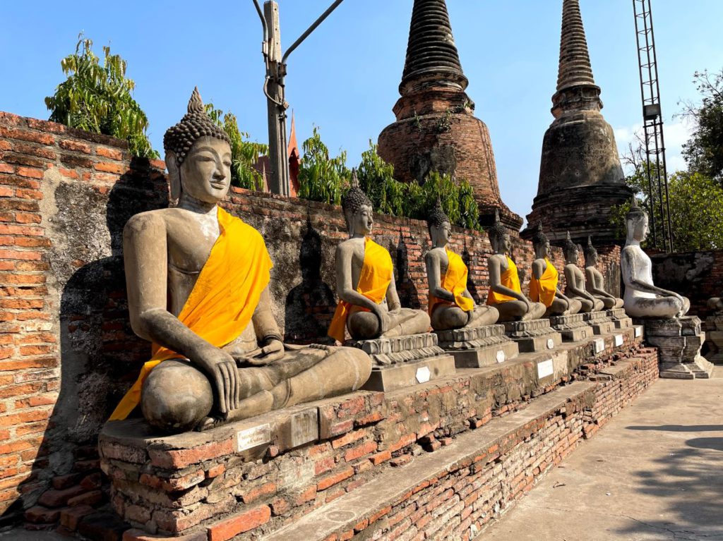 Buddha statues in a row around the pagoda, Ayutthaya