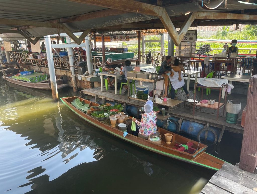 A boat serving food at Taling Chan Floating Market