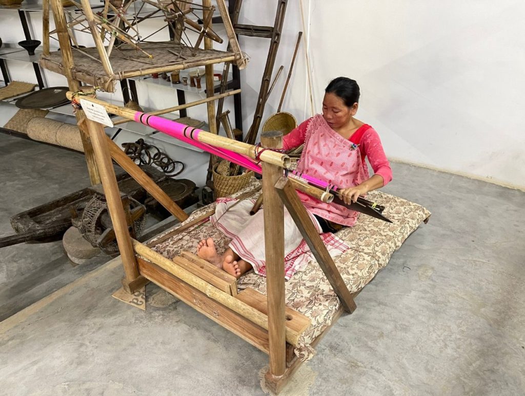 An Assamese lady weaving