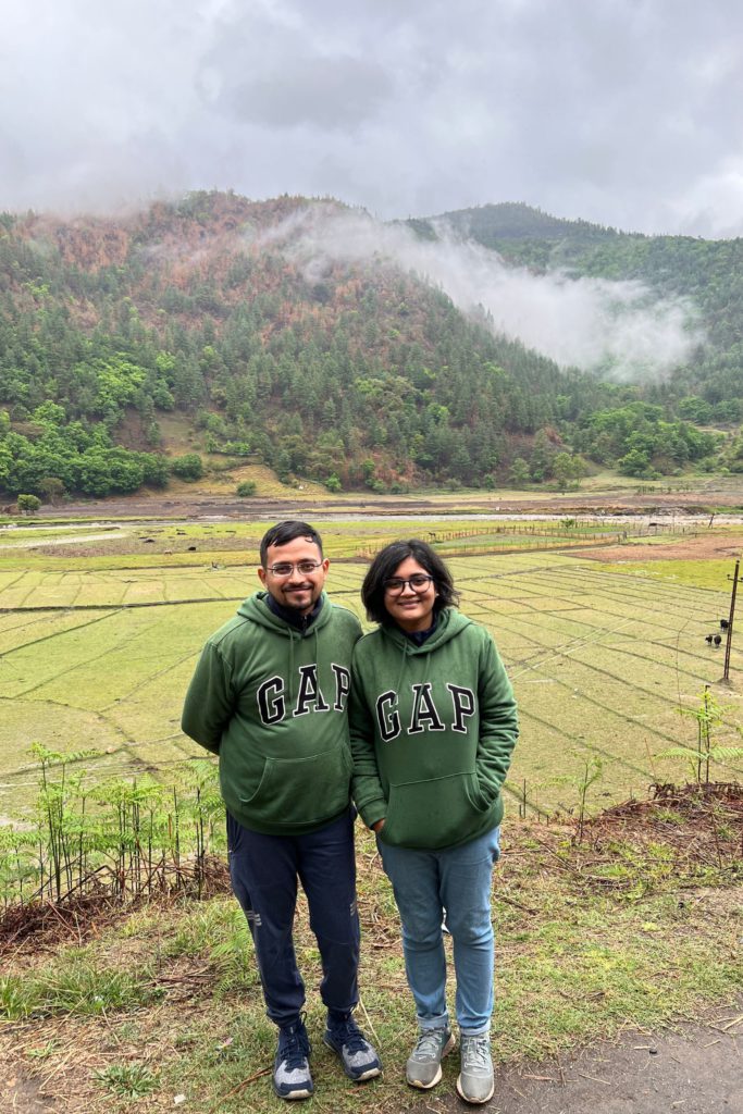 Posing for photos with beautiful green paddy fields