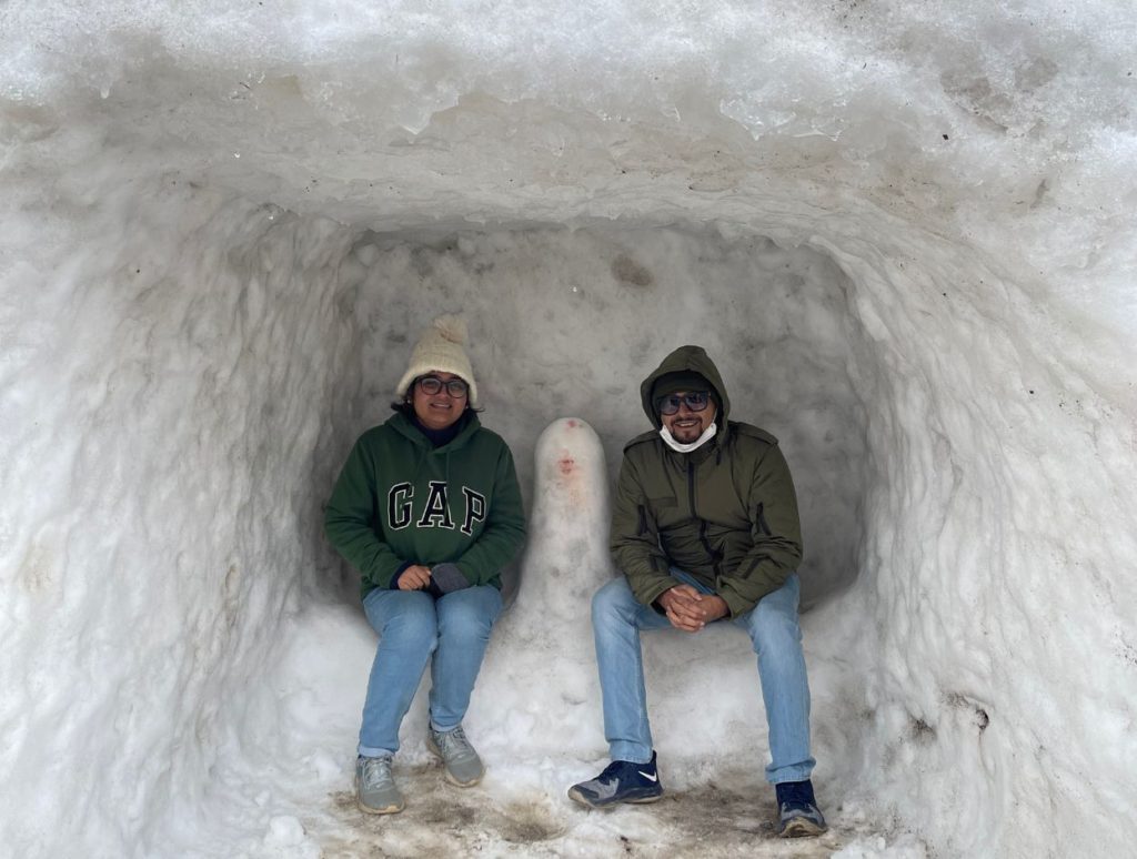 Posing inside an igloo at Bum La Pass