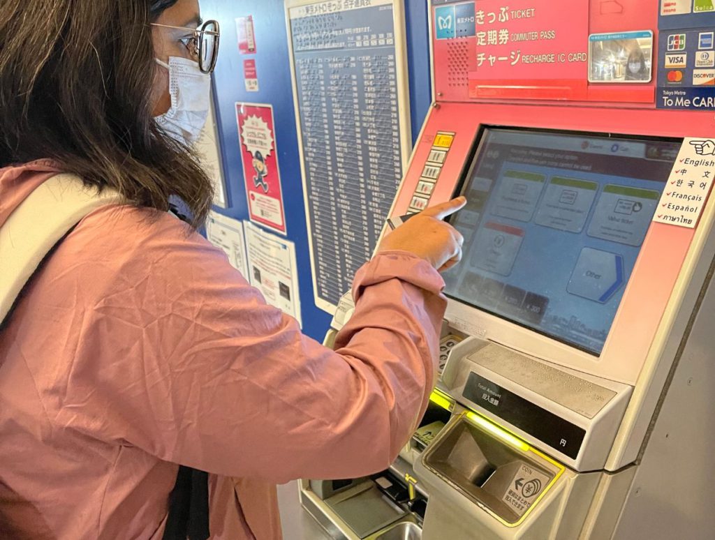 Buying a ticket at the vending machine