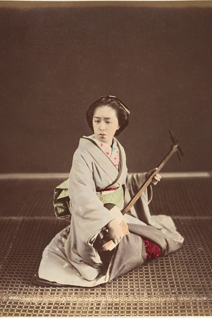 Photo of a Geisha with Shamisen in c1870s,