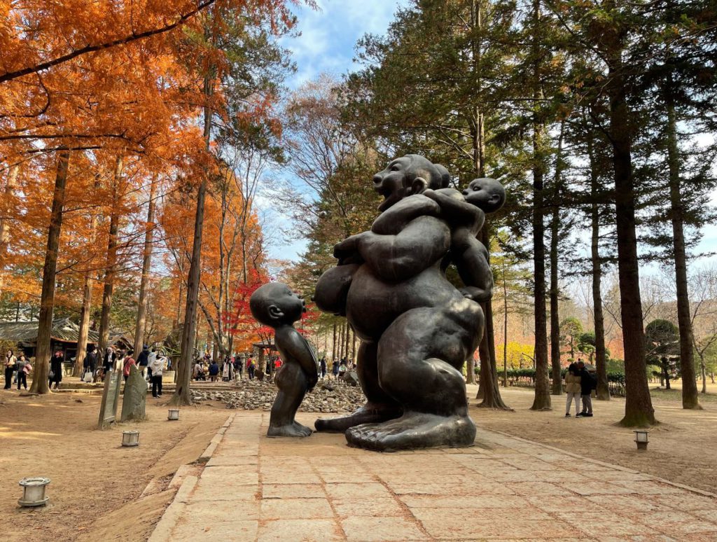 An iconic sculpture of a lady and her two children at Nami Island