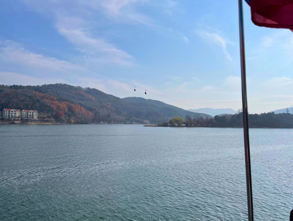 People ziplining to the island